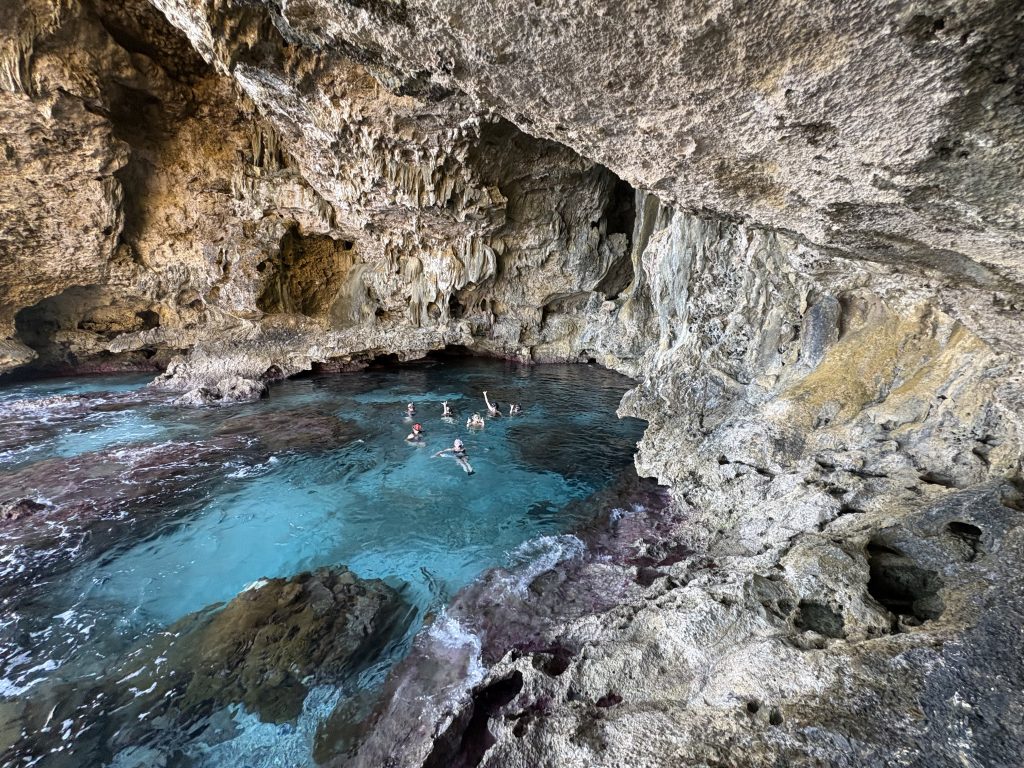 The famil group takes a dive in Avaiki Cave.