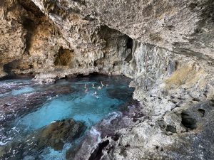 The famil group takes a dive in Avaiki Cave.